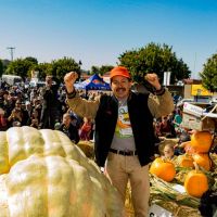 2019 Pumpkin Weigh-Off winner Leonardo Urena celebrates
