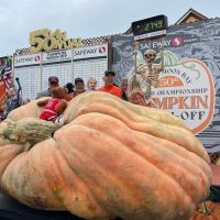Winner Travis Gienger and his 2749 lb champion pumpkin