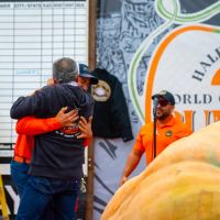 Winner Travis Gienger hugs Mel Mello, Jr.